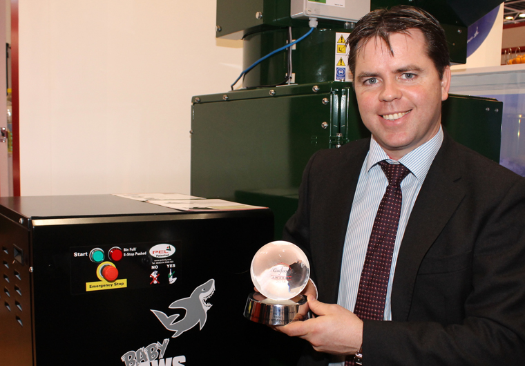 PEL Waste Reduction Equipment CEO Tommy Griffith with baby jaws glass bottle crusher wins award