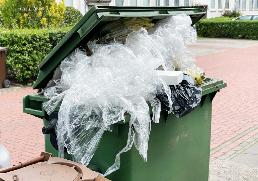 sustainable waste solutions plastic overflowing in bin