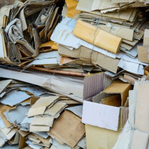 large pile of loose cardboard on ground